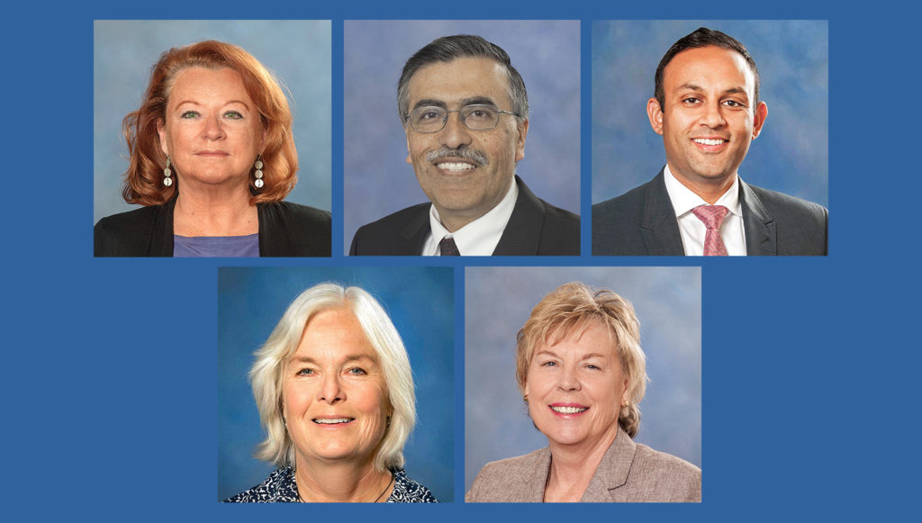 Grid of photos of the current Commissioners