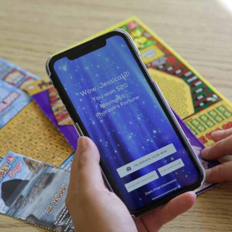 hand holding phone showing win message after scanning scratch-its