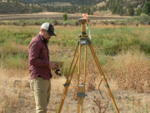 Surveyor taking measurements