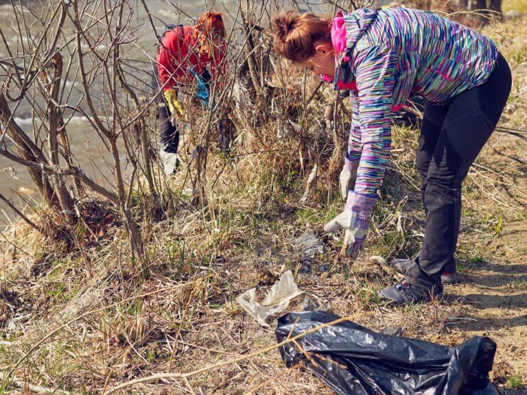 Volunteer perform river cleanup