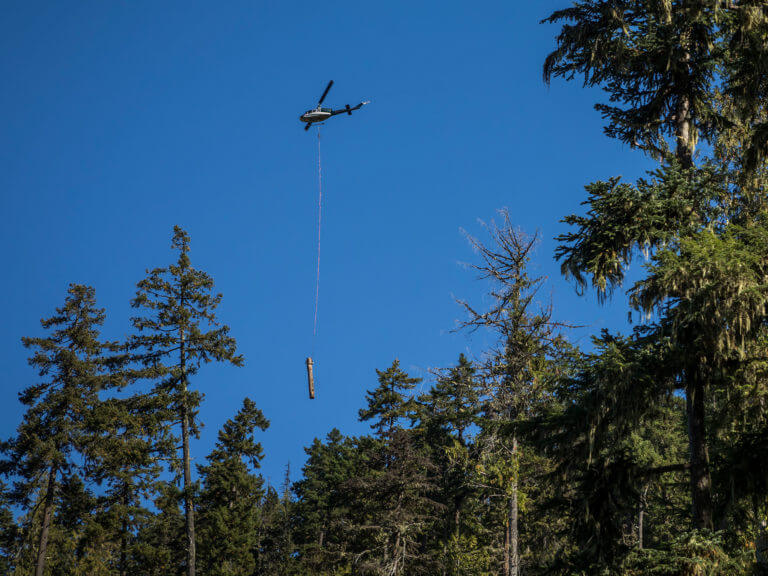 A helicopter moving a log