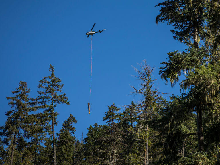 A helicopter moving a log