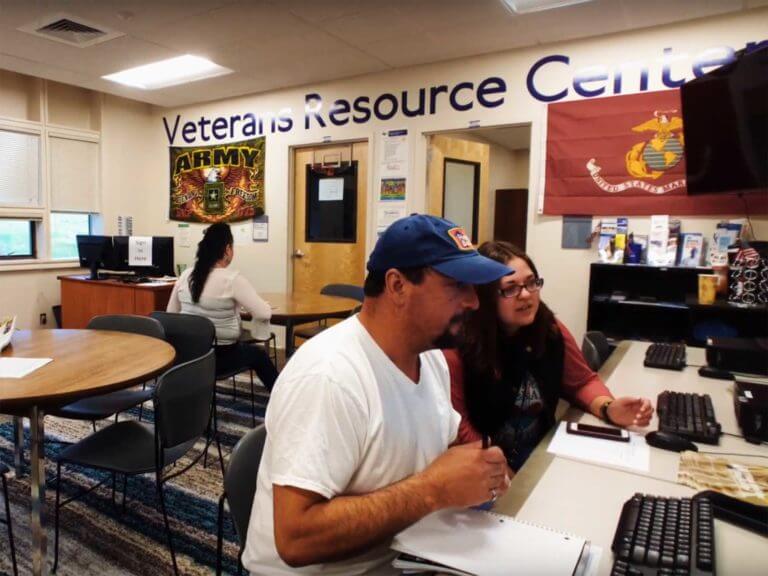 Student veteran using a laptop