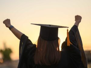 Graduate in cap and gown