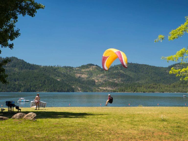 Hang gliding at water's edge