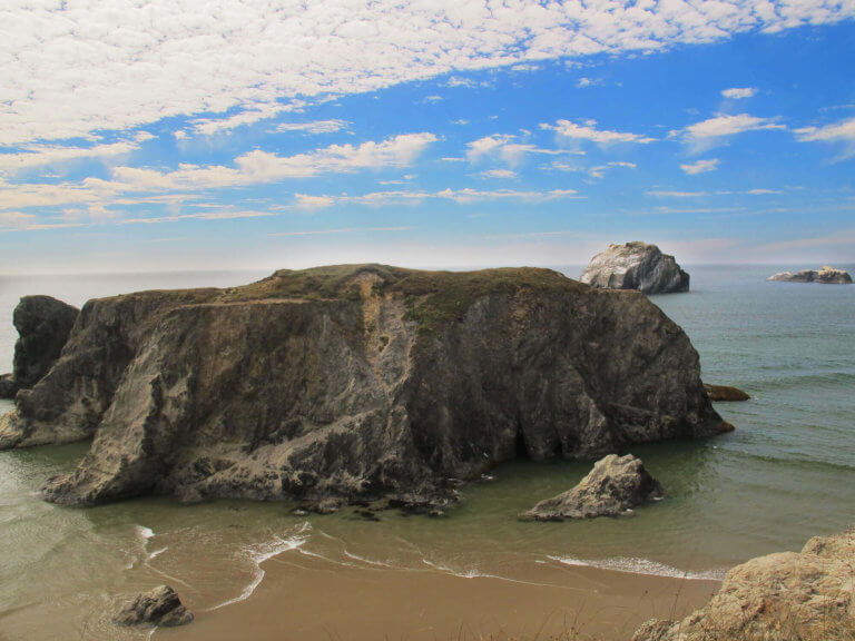 Aerial view of Face Rock, in shallow coastal waters