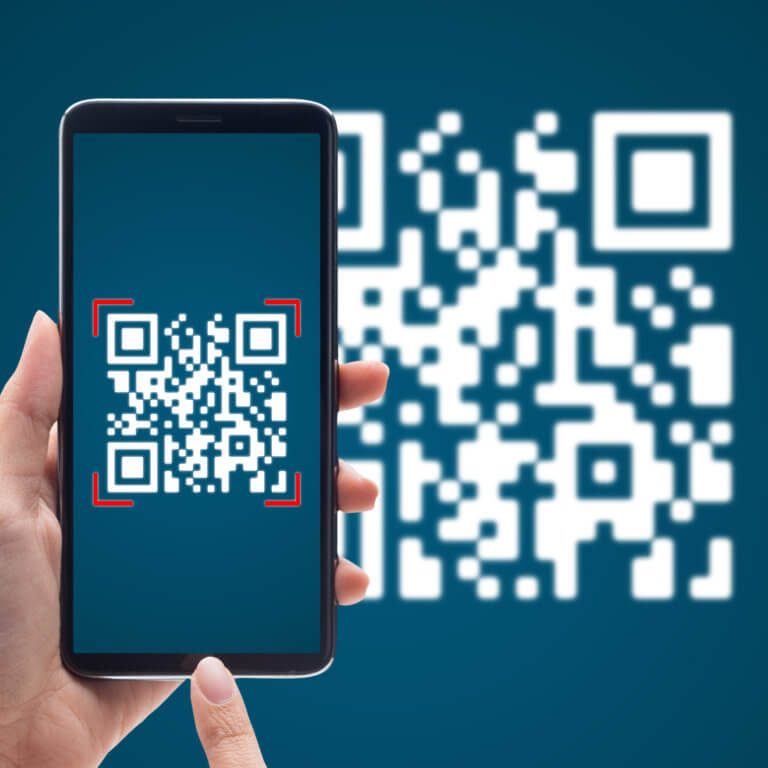 Hand holding a mobile phone with a large QR code on the phone screen