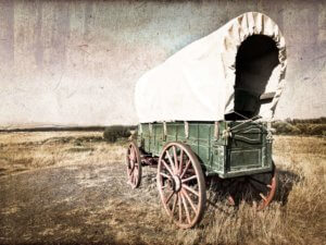 Covered wagon on a desolate plain