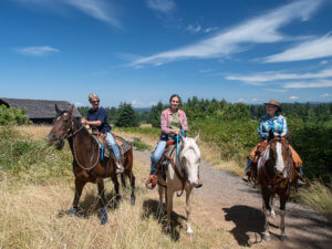 People horseback riding at Milo McIver State Park