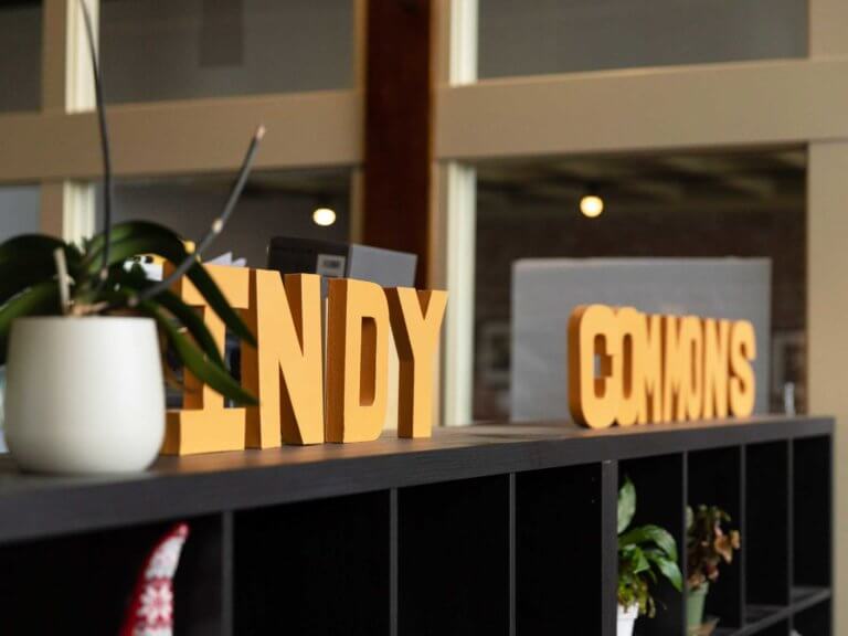 Indy Commons sign on shelving unit