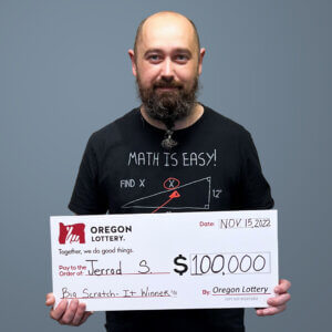 Jerrod S holding a check