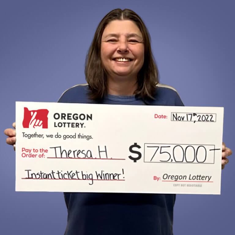 Theresa H holding a check