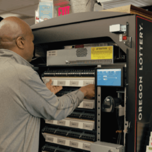Lottery employee repairing a Lottery vending machine