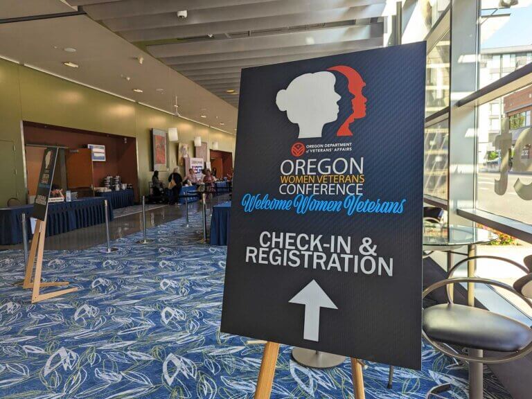 A lobby sign welcoming attendees to the conference.